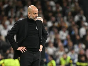 Manchester City's Spanish manager Pep Guardiola watches his players from the touchline during the UEFA Champions League quarter final first leg football match between Real Madrid CF and Manchester City at the Santiago Bernabeu stadium in Madrid on April 9, 2024. (Photo by JAVIER SORIANO / AFP)
