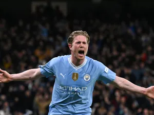 Manchester City's Belgian midfielder #17 Kevin De Bruyne celebrates after scoring his team first and equalising goal during the UEFA Champions League quarter-final second-leg football match between Manchester City and Real Madrid, at the Etihad Stadium, in Manchester, north-west England, on April 17, 2024. (Photo by Paul ELLIS / AFP)