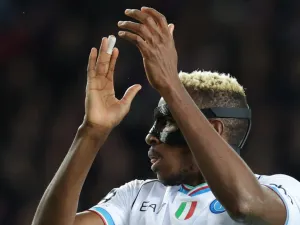 Napoli's Nigerian forward #09 Victor Osimhen claps during the UEFA Champions League last 16 second leg football match between FC Barcelona and SSC Napoli at the Estadi Olimpic Lluis Companys in Barcelona on March 12, 2024. (Photo by LLUIS GENE / AFP)