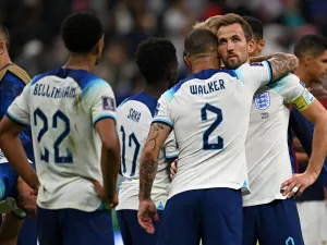 England's defender #02 Kyle Walker and England's forward #09 Harry Kane react at the end of the Qatar 2022 World Cup quarter-final football match between England and France at the Al-Bayt Stadium in Al Khor, north of Doha, on December 10, 2022. (Photo by Paul ELLIS / AFP)