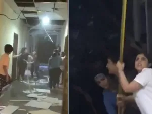 فتيات يستخدمن عصيا طويلة لتكسير الأبواب وسقف المبنى