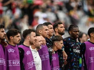 Portugal's players listen to the national anthem before the start of the international friendly football match between Portugal and Croatia at Jamor stadium in Oeiras on June 8, 2024. (Photo by PATRICIA DE MELO MOREIRA / AFP)