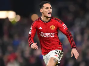 Manchester United's Brazilian midfielder #21 Antony reacts during the UEFA Champions League group A football match between Manchester United and FC Bayern Munich at Old Trafford stadium in Manchester, north west England, on December 12, 2023. (Photo by PETER POWELL / AFP)
