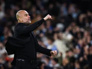 Manchester City's Spanish manager Pep Guardiola celebrates following his team first goal scored by Manchester City's Belgian midfielder #17 Kevin De Bruyne during the UEFA Champions League quarter-final second-leg football match between Manchester City and Real Madrid, at the Etihad Stadium, in Manchester, north-west England, on April 17, 2024. (Photo by Darren Staples / AFP)