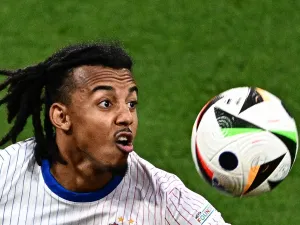 France's defender #05 Jules Kounde looks at the ball during the UEFA Euro 2024 Group D football match between the Netherlands and France at the Leipzig Stadium in Leipzig on June 21, 2024. (Photo by GABRIEL BOUYS / AFP)