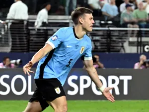 Uruguay's midfielder #05 Manuel Ugarte celebrates after scoring in a penalty shoot-out to win the Conmebol 2024 Copa America tournament quarter-final football match between Uruguay and Brazil at Allegiant Stadium in Las Vegas, Nevada on July 6, 2024. (Photo by Robyn Beck / AFP)