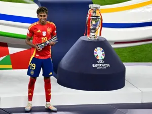 Spain's forward #19 Lamine Yamal celebrates winning the young player of the tournament award after the UEFA Euro 2024 final football match between Spain and England at the Olympiastadion in Berlin on July 14, 2024. (Photo by Tobias SCHWARZ / AFP)