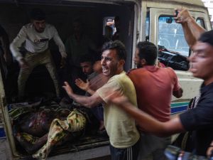 displaced Palestinians at Al-Tabeen school in Gaza City