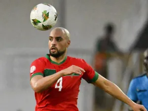 Morocco's midfielder #4 Sofyan Amrabat heads the ball during the Africa Cup of Nations (CAN) 2024 group F football match between Morocco and Tanzania at Stade Laurent Pokou in San Pedro on January 17, 2024. (Photo by SIA KAMBOU / AFP)