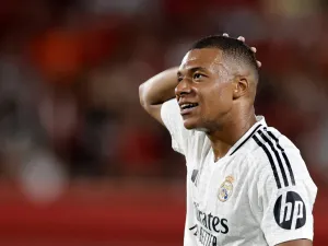 Real Madrid's French forward #09 Kylian Mbappe reacts during the Spanish league football match between RCD Mallorca and Real Madrid CF at the Mallorca Son Moix stadium in Palma de Mallorca on August 18, 2024. (Photo by OSCAR DEL POZO / AFP)