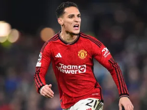 Manchester United's Brazilian midfielder #21 Antony reacts during the UEFA Champions League group A football match between Manchester United and FC Bayern Munich at Old Trafford stadium in Manchester, north west England, on December 12, 2023. (Photo by PETER POWELL / AFP)