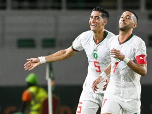 orocco's midfielder #7 Hakim Ziyech (R) celebrates with Morocco's defender #5 Nayef Aguerd after scoring his team's first goal during the Africa Cup of Nations (CAN) 2024 group F football match between Zambia and Morocco at the Stade Laurent Pokou in San Pedro on January 24, 2024. (Photo by SIA KAMBOU / AFP)