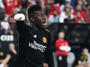 Manchester United's goalkeeper Andre Onana yells at teammates after saving the ball during a pre-season friendly football match between Manchester United FC and Borussia Dortmund at the Allegiant Stadium in Las Vegas, Nevada, on July 30, 2023. (Photo by Patrick T. Fallon / AFP)