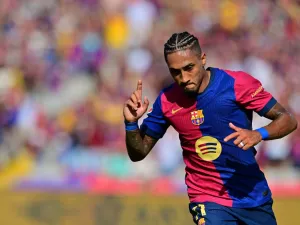 Barcelona's Brazilian forward #11 Raphinha celebrates scoring his team's first goal during the Spanish league football match between FC Barcelona and Real Valladolid FC at the Estadi Olimpic Lluis Companys in Barcelona on August 31, 2024. (Photo by MANU QUINTERO / AFP)