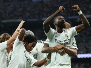 Real Madrid's German defender #22 Antonio Ruediger celebrates with teammates after scoring his team's second goal during the UEFA Champions League 1st round day 1 football match between Real Madrid CF and Stuttgart VFB at the Santiago Bernabeu stadium in Madrid on September 17, 2024. (Photo by Thomas COEX / AFP)