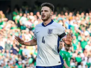 England's midfielder #04 Declan Rice reacts after scoring the team's first goal during the UEFA Nations League, League B, group 2, football match between Ireland and England at the Aviva Stadium, in Dublin, on September 7, 2024. (Photo by PAUL FAITH / AFP)