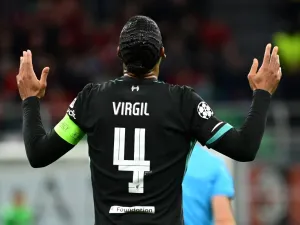 Liverpool's Dutch defender #04 Virgil van Dijk celebrates scoring his team's second goal during the UEFA Champions League 1st round day 1 football match between AC Milan and Liverpool FC at the San Siro stadium in Milan on September 17, 2024. (Photo by PIERO CRUCIATTI / AFP)