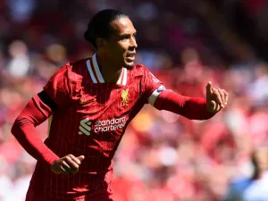 Liverpool's Dutch defender #04 Virgil van Dijk reacts during the pre-season friendly football match between Liverpool and Sevilla at Anfield stadium in Liverpool, northwest England on August 11, 2024. (Photo by Peter POWELL / AFP)