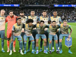 Manchester City players pose for a team photo ahead of the UEFA Champions League, league phase football match between Manchester City and Inter Milan at the Etihad stadium, in Manchester, north-west England, on September 18, 2024 (Photo by Oli SCARFF / AFP)