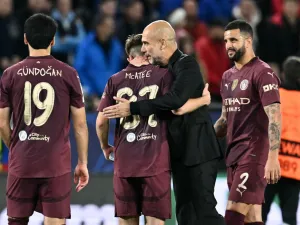 Manchester City's Spanish manager Pep Guardiola (2R) celebrates with Manchester City's English midfielder #87 James McAtee and team mates after the UEFA Champions League football match between SK Slovan Bratislava and Manchester City in Bratislava, Slovakia on October 1, 2024. Manchester City won the match 4-0. (Photo by Joe Klamar / AFP)