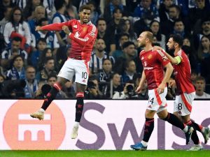 Manchester United's English forward #10 Marcus Rashford celebrates scoring the opening goal during the UEFA Europa League 1st round day 2 between FC Porto and Manchester United at the Dragao stadium in Porto on October 3, 2024. (Photo by MIGUEL RIOPA / AFP)