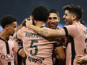 Paris Saint-Germain's Brazilian defender #05 Marquinhos (C) celebrates with teammates after scoring a goal that was later dismissed during the French L1 football match between Paris Saint-Germain (PSG) and Stade Rennais FC at The Parc des Princes Stadium in Paris on September 27, 2024. (Photo by Franck FIFE / AFP)