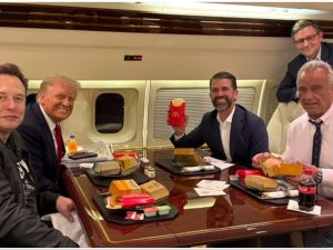 President-elect Donald Trump, Elon Musk, Donald Trump Jr. and Robert F. Kennedy Jr. (RFK Jr.) eating McDonald's on a plane. (Donald Trump Jr./X)
