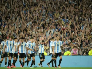 Argentina's forward #10 Lionel Messi celebrates with teammates after scoring a goal during the 2026 FIFA World Cup South American qualifiers football match between Argentina and Bolivia at the Mas Monumental stadium in Buenos Aires on October 15, 2024. (Photo by JUAN MABROMATA / AFP)