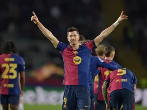Barcelona's Polish forward #09 Robert Lewandowski celebrates scoring his team's third goal during the UEFA Champions League, league phase day 5 football match between FC Barcelona and Stade Brestois 29 (Brest) at the Estadi Olimpic Lluis Companys in Barcelona, on November 26, 2024. (Photo by MANAURE QUINTERO / AFP)