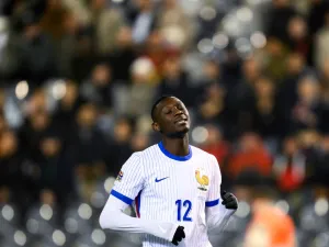 France's forward #12 Randal Kolo Muani reacts after missing a goal opportunity during the UEFA Nations League League A, Group A2 football match between Belgium and France, at the King Baudouin Stadium in Brussels, on October 14, 2024. (Photo by JOHN THYS / AFP)