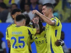 Nassr's Portuguese forward #07 Cristiano Ronaldo celebrates with teammates after their third goal in the Saudi Pro League football match between Al-Nassr and Al-Orobah at Al-Awwal Park in Riyadh on October 5, 2024. (Photo by Fayez NURELDINE / AFP)