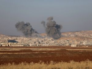 Smoke billows the the Syrian town of Suran, between Aleppo and Hama, on December 3, 2024.