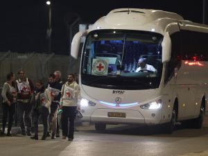 Hamas frees three Israeli prisoners; Palestinian prisoners begin release