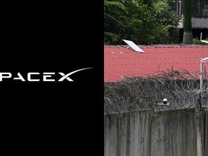 SpaceX/ This photo taken on September 17, 2025 shows what appears to be a Starlink satellite dish on the roof of a building at the KK Park complex in Myanmar's eastern Myawaddy township, as pictured from Mae Sot district in Thailand's border province of Tak. (Photo by AFP) Myanmar