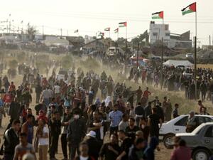 Palestinians gather to protest near the Israeli border fence, east of Gaza City in the central Gaza Strip on Apr. 13, 2018. Several thousand Gazans gathered for a third consecutive Friday of mass protests along the border with Israel after violence in which Israeli forces have killed 33 Palestinians and wounded hundreds of others.
(MAHMUD HAMS / AFP)