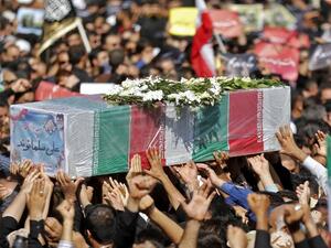 Thousands of people gather in the south-western Iranian city of Ahvaz for the funeral of those killed during an attack on a military parade (AFP)