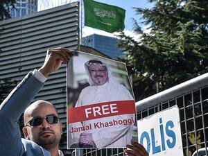 A protester holds a picture of Saudi journalist Jamal Khashoggi during a demonstration in front of Saudi Consulate. (AFP/File)