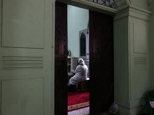 A Muslim woman attends a special prayer for the victims of the Christchurch mass shooting in New Zealand (AFP)