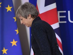 British Prime Minister Theresa May walks after holding a press conference on March 22, 2019, on the first day of an EU summit focused on Brexit, in Brussels. (Emmanuel DUNAND / AFP)