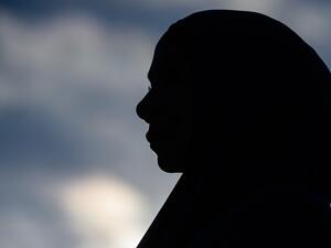 A woman attends a vigil in memory of the twin mosque massacre victims in Christchurch (AFP)