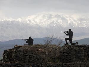 Silhouette sculptures of Israeli soldiers are pictured at an army post on Mount Bental in the Israeli-annexed Golan Heights (AFP)