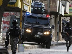 Jordanian security forces secure a street in the town of Irbid, 80 kms north of the capital Amman, near the border with Syria, on March 2, 2016, following a security operation targeting a group of suspected jihadists. (AFP/Khalil Mazraawi)