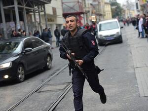 A Turkish policeman runs after an explosion on the pedestrian Istiklal avenue in Istanbul on March 19, 2016. Two people, including the bomber, were killed and six others injured in a suicide attack on a major shopping street in Istanbul on Saturday, Turkey's CNN-Turk television reported. (AFP/File)
Bulent KILIC / AFP