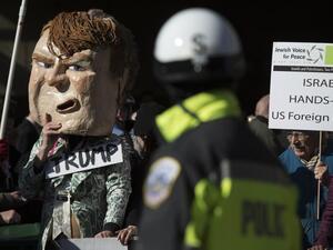 Protesters gather outside Verizon Center where Donald Trump and other presidential primary candidates are speaking during the AIPAC 2016 Policy Conference on March 21, 2016 in Washington, DC. (AFPMolly Riley)