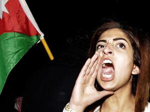 A Jordanian woman chanting during a protest (AFP/File Photo)	