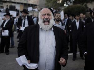 Ultra-Orthodox Jewish men protest against Pope Francis' upcoming visit to the Holy Land, on May 12, 2014 in the Old City of Jerusalem, near King David's tomb. (AFP/Ahmad Gharabli)