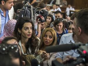 AP was criticized for describing Amal Clooney as an 'actor's wife' in coverage of the Al Jazeera trial. (AFP)