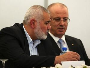 Hamas chief Ismail Haniya and Palestinian Prime Minister Rami Hamdallah at Haniya's office in Gaza City on Oct. 3, 2017 (AFP)