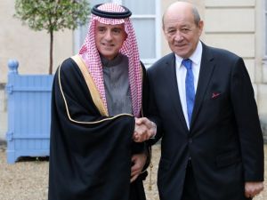 Saudi foreign affairs minister Adel Al Jubeir (L) is welcomed by French foreign affairs minister Jean Yves Le Drian upon his arrival for a summit from the underfunded G5 Sahel anti-terror coalition on Dec. 13, 2017 (Ludovic MARIN/AFP)
