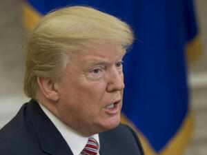 US President Donald Trump speaks to the press in the Oval Office of the White House in Washington, DC, Feb. 9, 2018. 
(SAUL LOEB / AFP)